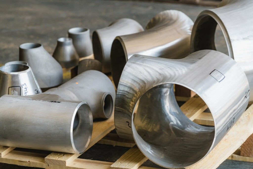 a collection of aluminium pipes bent and assembled in different shapes